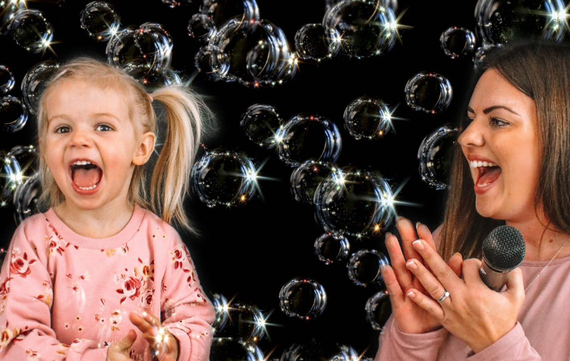 mum and daughter surrounded by bubbles
